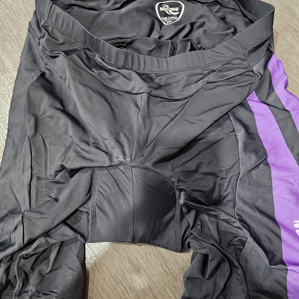 NOOYME Women's Padded Cycling Shorts in the black and purple colorway.